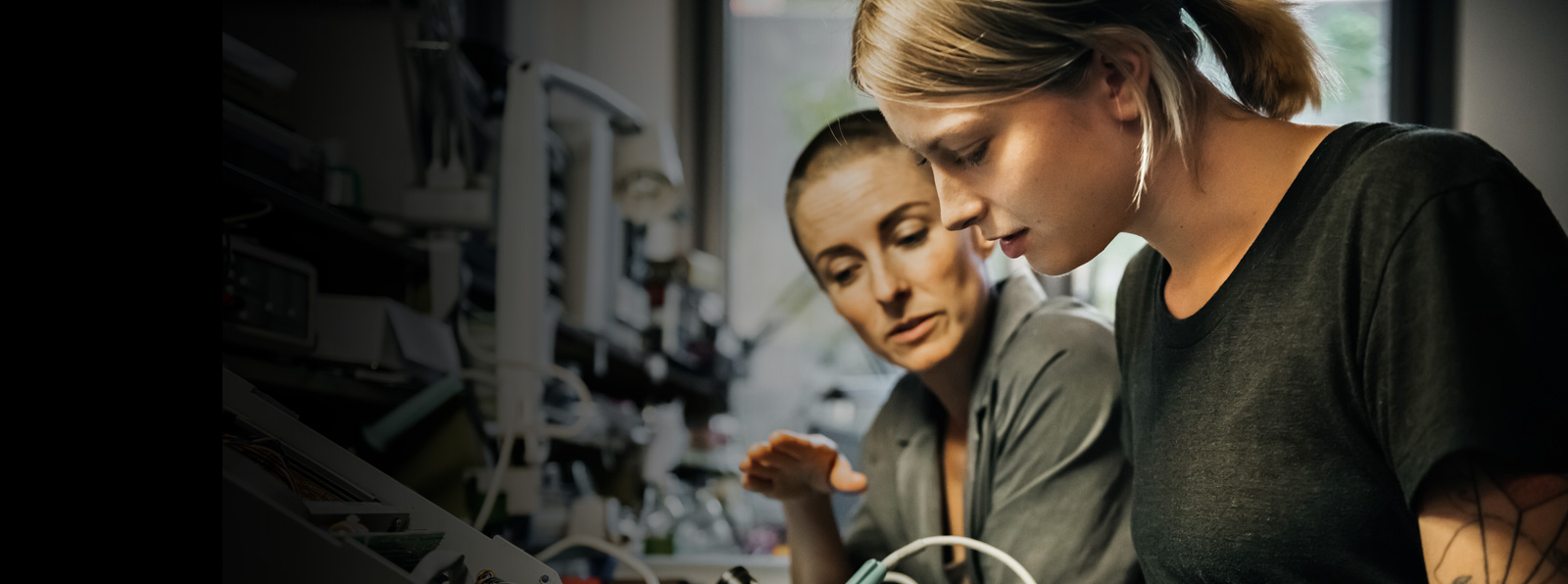Two woman work together on a project