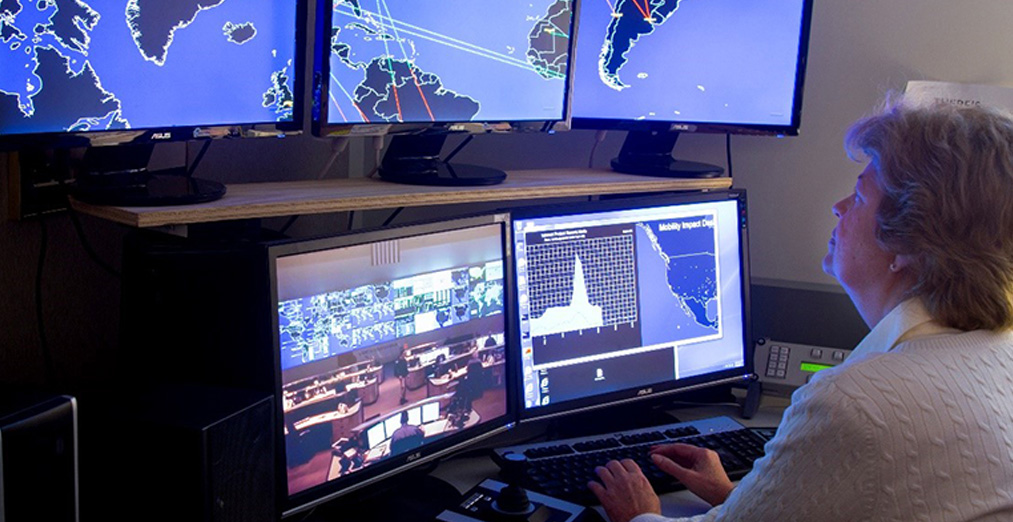 A woman looking at real time network traffic on maps