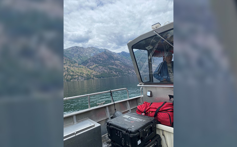 FirstNet Mini Compact Rapid Deployable (miniCRD) being transported across Lake Chelan during the Pioneer Fire.